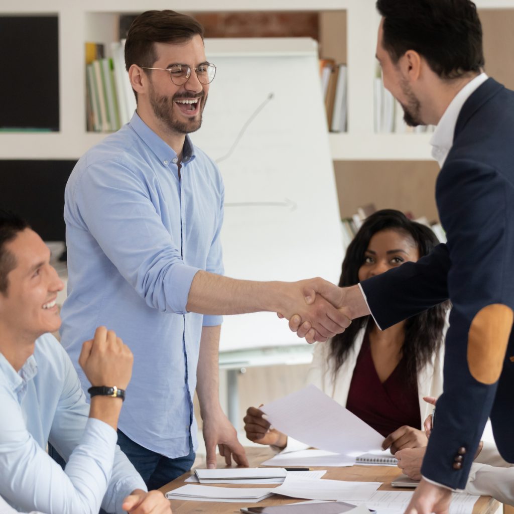 happy team shaking hands