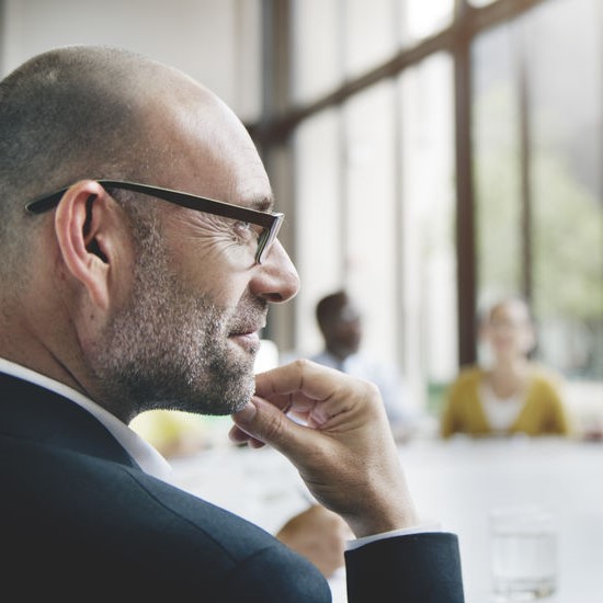 business man considering growth of company